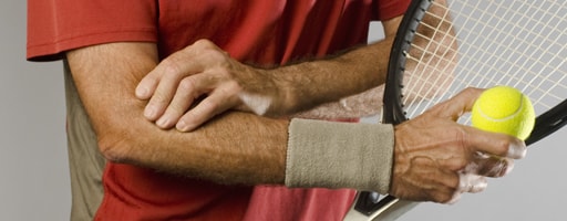 Elbow joint pain Person showing the pain area in tennis elbow
